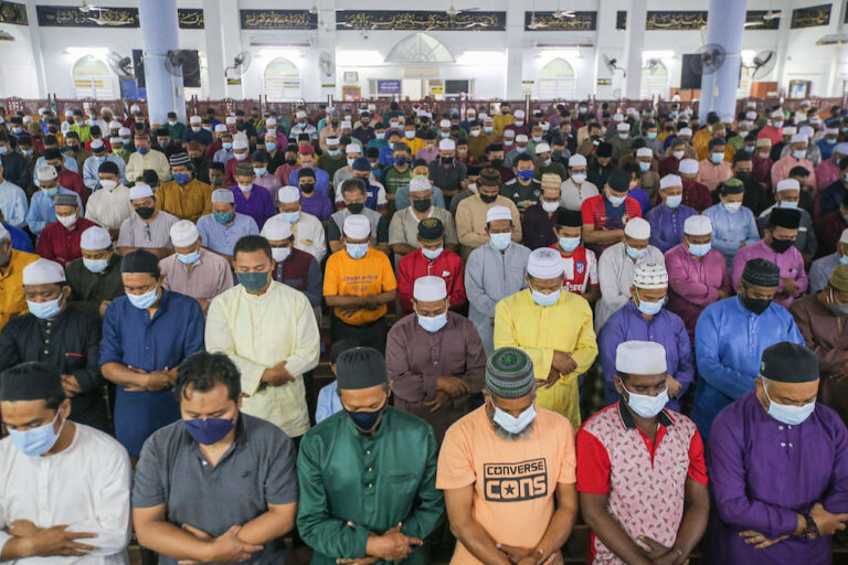 Muslims mark start of Ramadan with congregational tarawih prayers without physical distancing