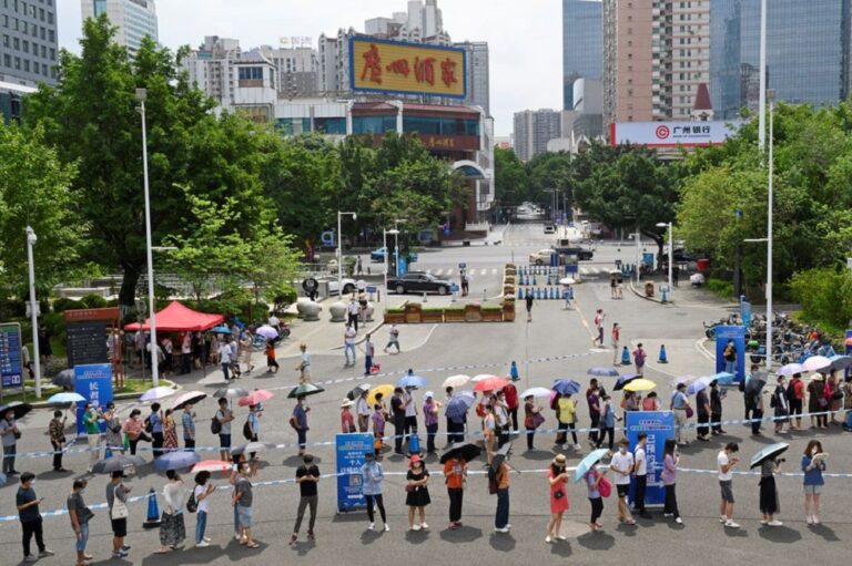 China megacity mass-tests, cancels flights after suspected Covid case