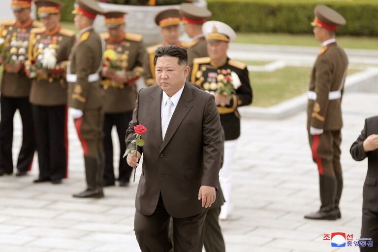 North Korea parades intercontinental ballistic missiles, vows to boost nuclear arsenal