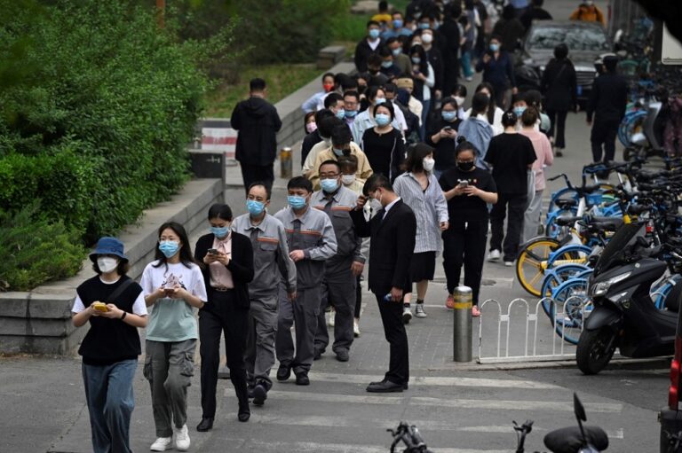 Beijing Covid-19 spike prompts mass testing, panic buying