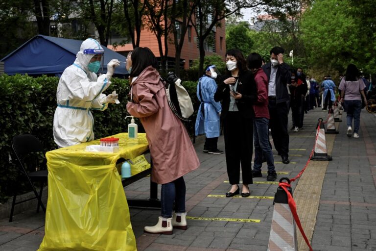 Beijing tightens Covid restrictions as long holiday begins