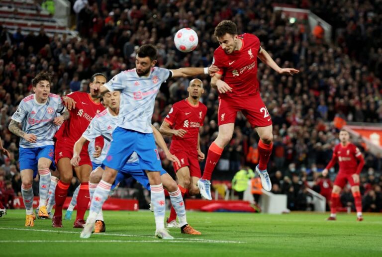 Liverpool go top after crushing United with Salah double
