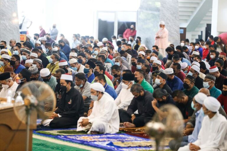 Muslims across Malaysia perform Friday prayers without physical distancing
