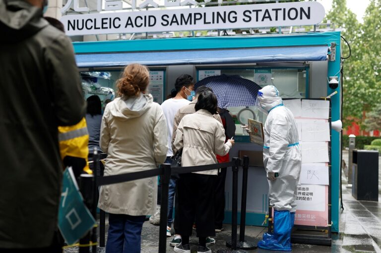 Beijing kicks off fresh round of Covid tests as Shanghai postpones crucial exams