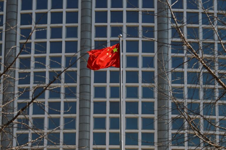 China denies suspending passports, invalidating foreign residency cards
