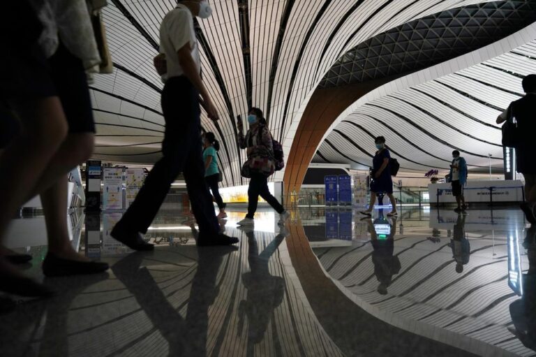 CCTV: Beijing to cut quarantine times for overseas arrivals