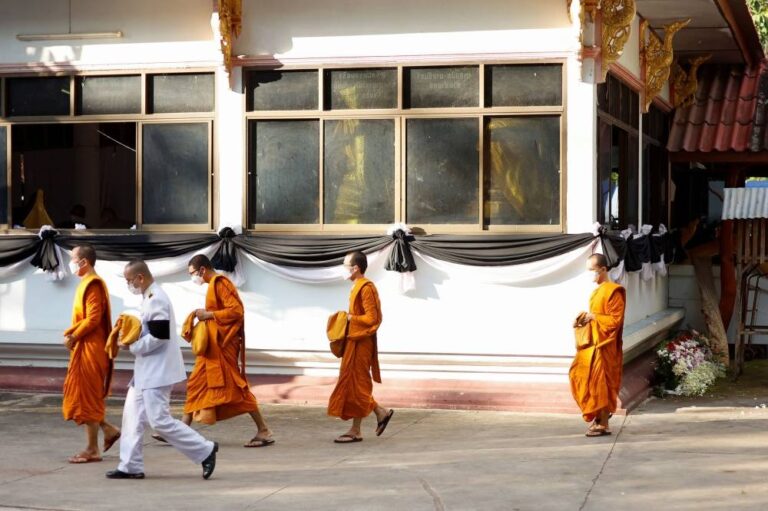 Prayers, sorrow at temples as Thailand mourns children slain in massacre