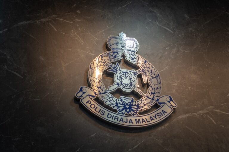 Activist wanted over alleged Facebook threats returns from Thailand and surrenders
