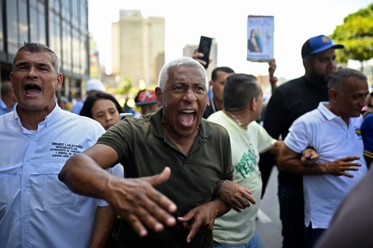 Venezuela’s political camps protest ahead of transition talks