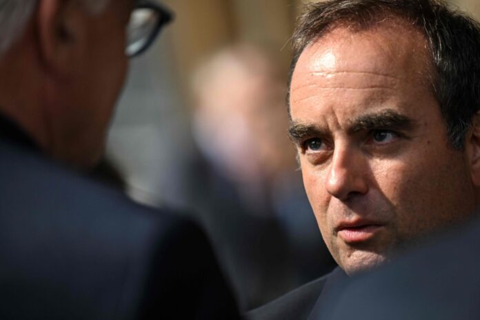 Residents jeer French PM on visit to fire-hit region