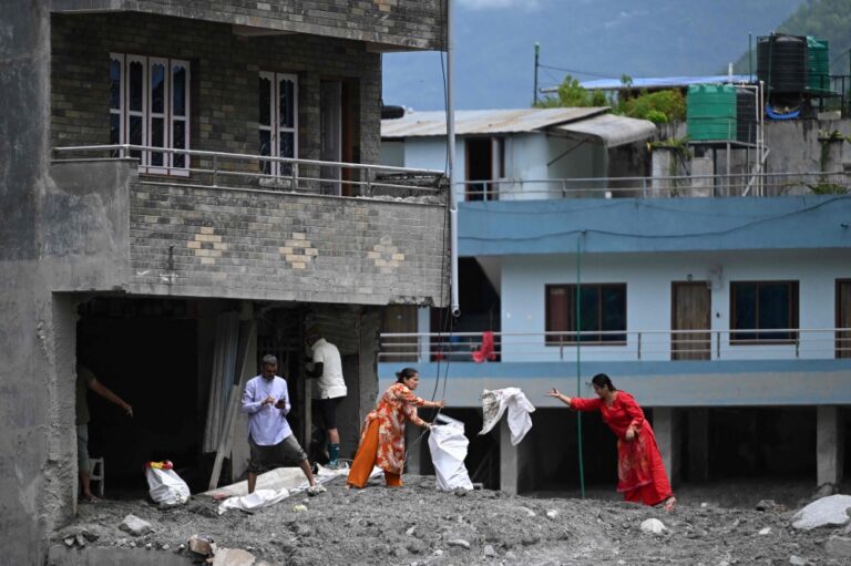 Grisly search for missing as Nepal morgues overflow, burials begin