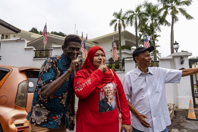 Handful of supporters wait outside Najib’s Langgak Duta residence after conditional pardon