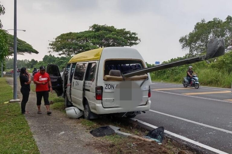 Van impaled by guardrail in Kuching crash, passenger injured